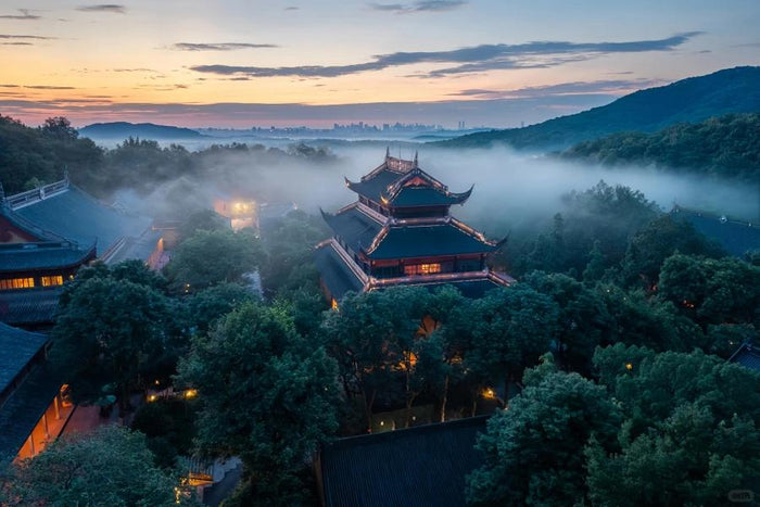 Traditional temple architecture among the wooded hills of Hangzhou's West Lake
