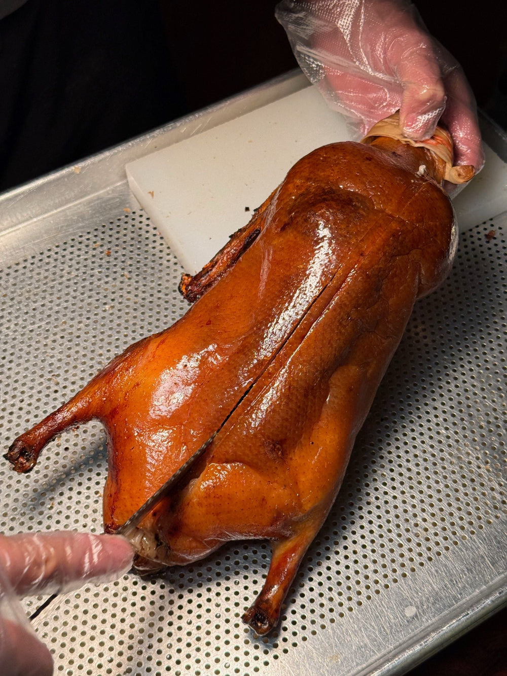 Authentic Beijing Peking Duck dinner with master chef tableside carving, traditional fruitwood oven culinary experience in Beijing